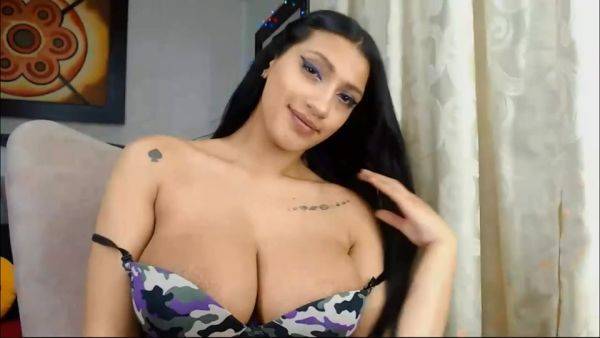 Busty Latina Babe Teaes In Front Of Webcam on pornoboobs.com