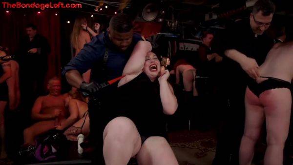Busty BDSM public redhead whipped in front of voyeurs on pornoboobs.com