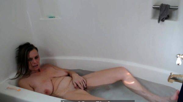 Busty Blonde MILF Masturbates and Orgasms in the Tub on pornoboobs.com